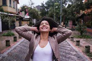 Ecuador Prints: Portrait of cute girl with curly hair on the street