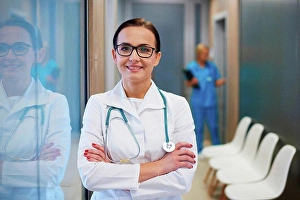 Gifted Prints: Portrait of doctor in hallway, arms folded, smiling