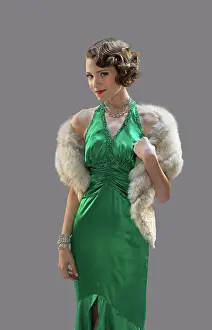 Elegance Prints: Portrait of a well dress woman against a gray background