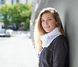 Graffiti Prints: Portrait, fashion and smile of woman at graffiti wall in city outdoor for street art
