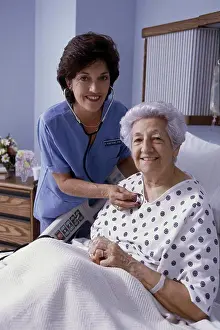 Assisted Prints: Portrait of a female nurse examining a patient