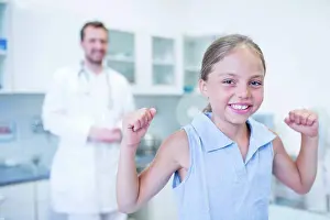 Result Prints: Portrait of girl cheering in doctor's surgery