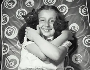Shoulders Prints: Portrait of a girl holding two kittens