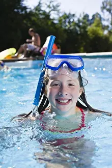Arts Culture And Entertainment Prints: Portrait of girl with scuba mask in swimming pool