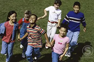 4 5 Years Prints: Portrait of a group of children running together holding hands