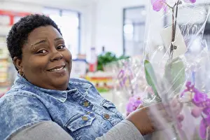 Disorder Prints: Portrait of a happy woman with bipolar disorder shopping for flowers