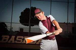 Moody Prints: Portrait of a High School baseball player in maroon uniform swing his bat