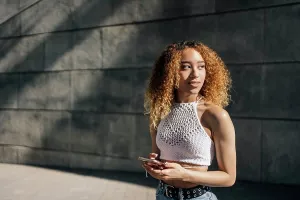 Texting Prints: Portrait Of Latin Girl in the city
