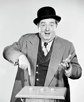 Smoking Prints: Portrait of a man pointing to nutshells
