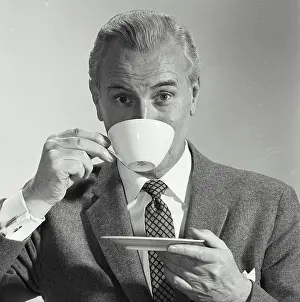 Beverage Prints: Portrait of a mature man drinking from a tea cup