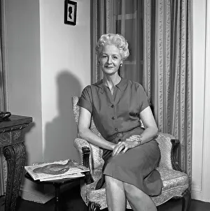 50 54 Years Prints: Portrait of mature woman sitting in armchair