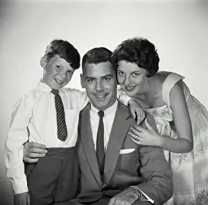 Shirt And Tie Prints: Portrait of a mid adult couple smiling with their son