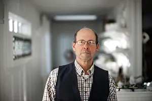 50 To 55 Years Prints: Portrait of a middle-aged man with a serious expression