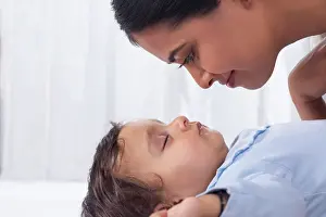 Bed Room Prints: Portrait of mother looking at sleeping baby with affection