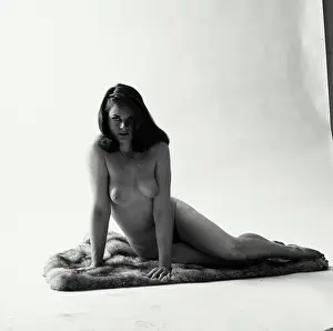 Breast Prints: Portrait of nude young woman sitting on blanket