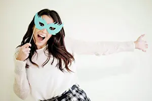 Upper Body Prints: Portrait of playful young woman with comedy glasses
