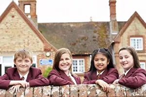 Uniform Prints: Portrait Of Pupils In Uniform Outside School Building
