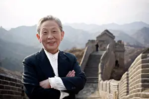 Out Door Prints: Portrait of a senior business woman standing on the Great Wall of China