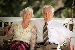 Husband Prints: Portrait of a Senior couple sitting on a porch swing