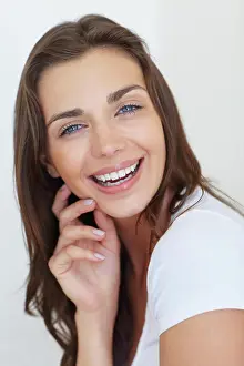 Perfect Prints: Portrait, smile and skincare with a young woman in studio on a white background for natural dermatology