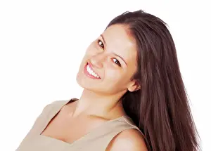 Perfect Prints: Portrait of one smiling beautiful woman isolated against white with copyspace in a studio