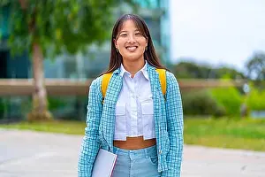 Campus Prints: Portrait of a smiling chinese university student standing in the campus