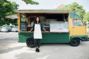 Self Employed Prints: Portrait of smiling female owner standing against food truck