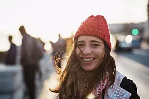 Sun Light Prints: Portrait of smiling mid adult woman wearing knit hat against sky during sunset