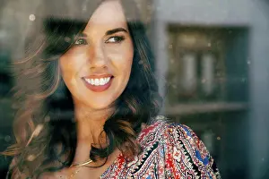 Curiosity Prints: Portrait of smiling Mixed Race woman behind window