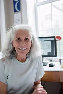 Desktop Computer Prints: Portrait of smiling older woman