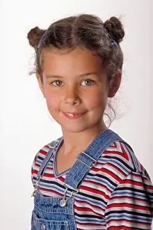 Overalls Prints: Portrait of Smiling Young Girl in Overalls