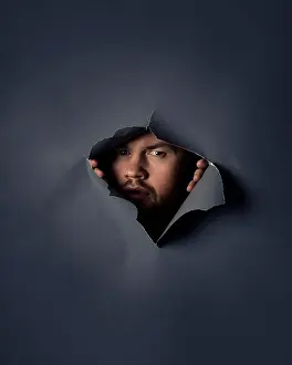 Curiosity Prints: Portrait suspicious man peeking through ripped wallpaper