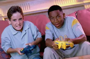Video Prints: Portrait of two teenage boys playing video games