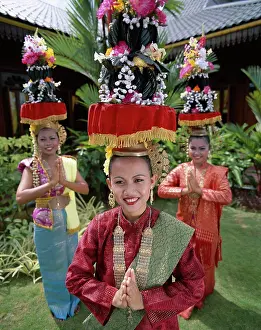 Wear Prints: Portrait of three teenage girls dressed in traditional Malay costumes