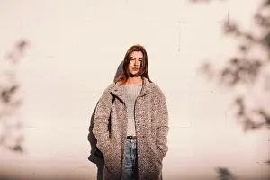 People In Nature Prints: Portrait of transgender woman standing against wall in city