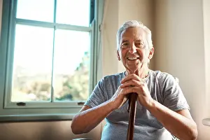 Disability Prints: Portrait, walking stick and senior man in home with happiness for healthcare