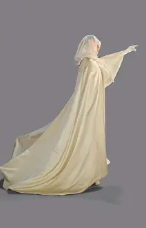 Mystery Prints: Portrait of a woman dressed as a ghost for Halloween turned profile with one arm reaching out