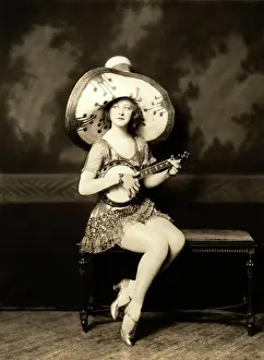 Beautiful Woman Prints: Portrait of woman in hat playing mandolin