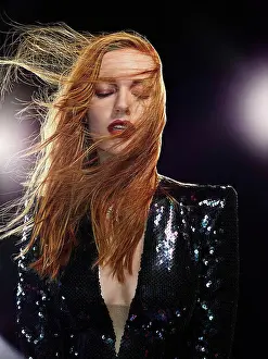 Dangerous Prints: Portrait of a woman with light flares and wind