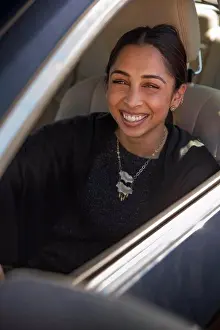 Video Prints: Portrait of woman sitting in drivers seat of car with window open