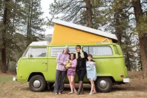 Gradeschooler Prints: Portrait of two women, two children and dog in front of green VW van