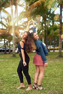Relaxed Prints: Portrait, women and friends holding hands outdoor for summer vacation