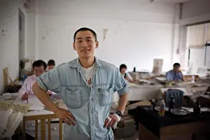 Instruction Prints: Portrait of a young adult man standing in an art classroom