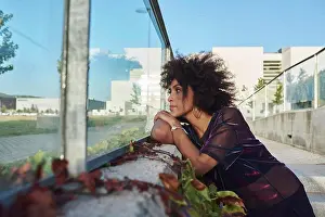 Mixed Prints: Portrait of a young afro girl in the city