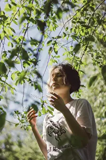 Body Parts Prints: Portrait of a young girl with closed eyes under the sun under a tree