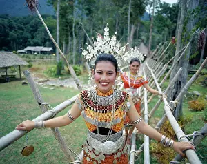 Portrait of two young Iban women dressed in traditional costumes, Sarawak Cultural Village, Sarawak, Malaysia