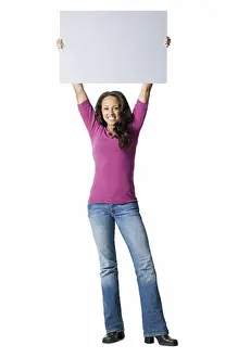 Full Length Prints: Portrait of a young woman holding a blank sign