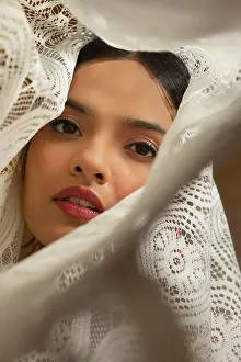 Expressive Prints: PORTRAIT OF A YOUNG WOMAN LOOKING AT CAMERA WRAPPED IN WHITE CLOTH