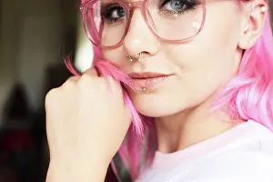 Individuality Prints: Portrait of young woman with pink hair, glasses and piercings