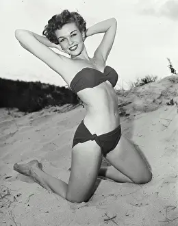 One Young Woman Only Prints: Portrait of young woman posing on beach